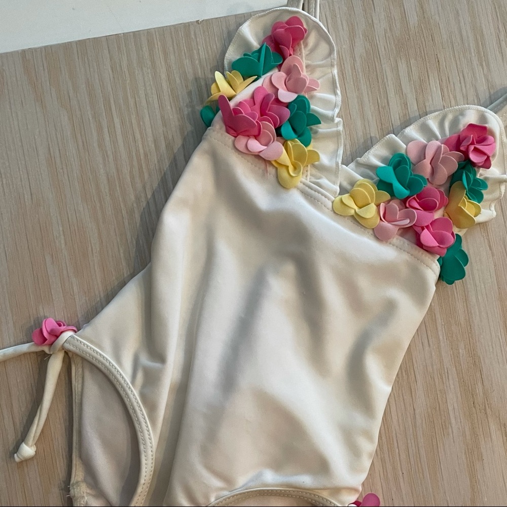 Juicy couture one piece swimsuit with flowers and ruffled bottom